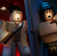 Charlie holds a knife while Zahrah is hiding behind the door