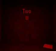 The second mask, behind a fake wall in the West side of the area.
