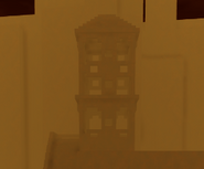 A picture of the building where the first button is located.