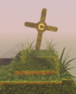 The grave that the player spawns in front of with the letter "C" on it.