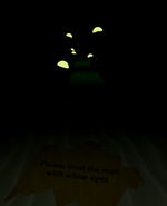 A note that reads “Please, trust the man with white eyes” in front of the teleport to Ruins.