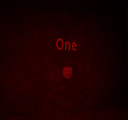 The first mask, behind a fake wall in the north side of the area.