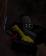 Bart Montgomery’s corpse inside of the safe in Ipiprix’s office, holding a key to room 103, with the flag of Australia next to him. Before his death, Ipiprix had his happy memories drained by a Mind Walker, evidence being the red hole on his forehead.