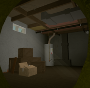The basement-like room that can be seen through a small window.