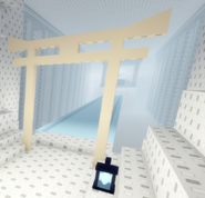 The shrine gate that when passed through will build an ice bridge to a machine that waits ahead. Found just after walking through the grey structure.