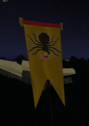 A new banner that is found past the pesticide near the house. It seems to now have the symbol for the Wooden Spider on it.