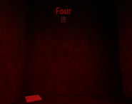 The fourth mask, behind a fake wall in the East side of the area.
