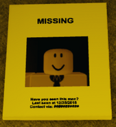 A missing person’s poster pasted outside the venue. The man in the poster is Mopherius.