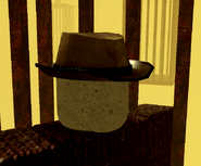 The player trapped in a cage at “Punishment”. Above them is a button that they can click to be released.