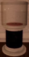 A pen in a cylinder display case.