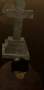 Freddy Josephs’ grave. The helmet can be taken from the skull here and used in a ritual in Bodysnatcher.