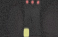 The memory cube at the end of the dark corridor, with three red eyes and a Mind Walker needle protruding from the wall.