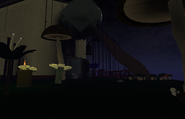 Outside the house, there is a tree leaning against it. The player can enter the house by going through the window.