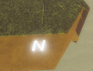 The letter "N" that can be touched by the player to progress through the game.