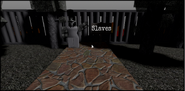 Zergred standing next to a sign with the word “Slaves” written on it. Behind her is a jail filled with Colorsdale citizens.