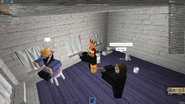 An image of Martin and BobbyCult pointing guns at the user "UberHaxor561".