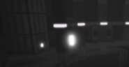 The open door in the town-like area in “ＡＳＨ .” that leads the player to the area where the experiment on the snow people was conducted.