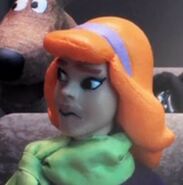 Daphne with a obvious fake mouth.