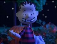 Linus in the pumpkin patch at night