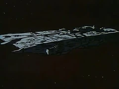 Zor’s battlefortress, seen here after emerging from hyperspace and entering Earth’s atmosphere. This account illustrates the ship appears much like its later rebuilt form but with a pristine, stark-silver hull and no battle damage. (Macross Saga: "Boobytrap")