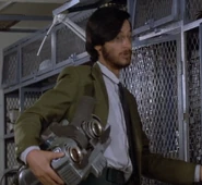 Ben Jabituya holding a S-A-I-N-T replacement head [possibly S-A-I-N-T Number 7]