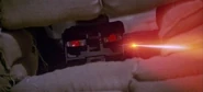 S-A-I-N-T robot firing its laser