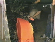 One half of Killertron's shell receives orange spray paint
