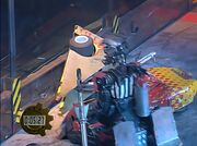 Refbot helps Dominator 2 get off of the arena wall