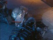 Refbot pulls Little Fly away from the wall