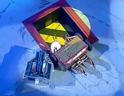 EWE2 pushes Sawpoint 2 into the Pit