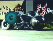 The Master is pinned down by Tazz's weapon