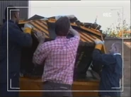 The RoboDoc team placing RoboDoc in a skip, in a clip shown in Robot Wars Revealed