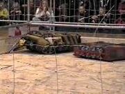 Inverterbrat being pushed by Tornado at Robot Rumble 2000