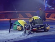 Bumblebot misses with an early attack of its axe