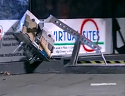 BioHazard lifts Hercules onto the arena side