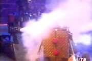 Refbot puts out Conquering Clown's internal fire and burning head