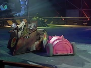 Robopig drives at the side of Napalm