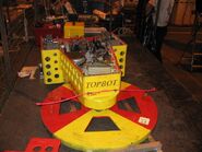 Topbot, without its top armour, in the pits