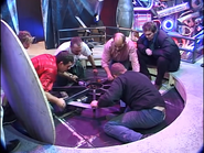 Crewmembers test the rotation of the turntable mechanism