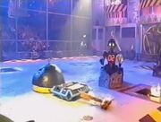 Impact pushes Beaverbot away from Refbot as he starts to count it out