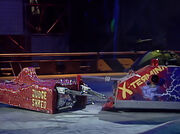 Judge Shred hold X-Terminator back with the lifting claws