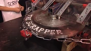 The Scrapper's logo - written on its weapon