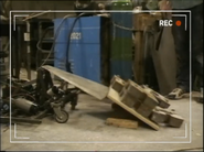 Elvis tips a stack of metal blocks