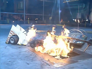 Killerhurtz is held over the Flame Pit by Spikasaurus and Dominator 2