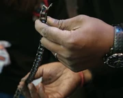 Suren Balendran inspects the damaged chain