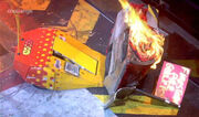 Diotoir lies on its side and in flames after getting flipped by Firestorm 3