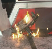 Flames surround Diotoir as it lays on its side