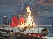 Shunt's axe crushes the plastic bucket of the flaming Mammoth