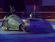 Sgt Bash charges into the two competitors knocking off Prometheus' top armour plate