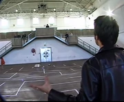 An unpainted SAT'arn in a race with an RC car during the Series 1 auditions